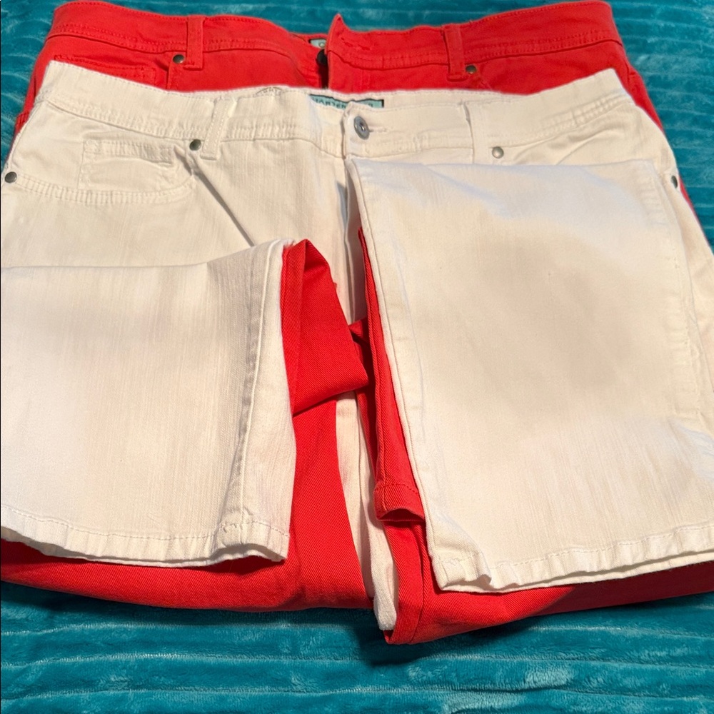 Two pairs Charter Club women’s jeans. One white and one orange. Size 16